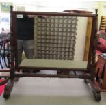 A Regency mahogany framed dressing table mirror, raised on turned, block supports, fan carved and