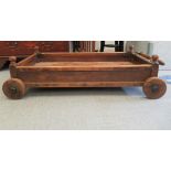 An early/mid 20thC (probably) Indian teak cart with wrought iron mounts  11"h  39"L