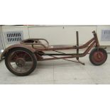 A vintage French Cyclo Etoile three wheeled, steel framed pedal cart with two spoked rubber back