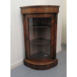 A late 19thC walnut and marquetry quadrant display cabinet with a glazed door, on a plinth  41"h