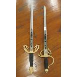 A pair of Spanish decorative swords, each with an inscribed blade  24"L