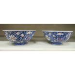 A pair of 20thC Chinese Republic period footed porcelain bowls with flared rims, decorated in