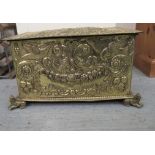 An early 20thC ornately pressed brass coal box with straight sides and a hinged lid, raised on