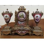 An early 20thC Continental porcelain and gilt metal mounted, three piece clock garniture; the