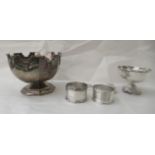 Silver items: to include an octagonal pedestal bowl  3"dia; a pedestal salt cellar; and two napkin