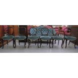 A set of six mid Victorian rosewood framed balloon back dining chairs, each with a blue fabric