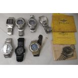 Seven variously styled stainless steel cased Casio wristwatches and various Breitling handbooks