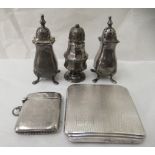 Silver items, viz. an Art Deco engine turned powder compact; a pair of pepper pots; and another; and