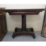 A Regency mahogany card table, the foldover top with beaded decoration, over a canon barrel column