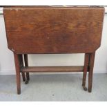 An Edwardian oak Sutherland table, raised on splayed, square legs  24"h  24"w