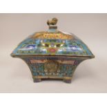 A 20thC Chinese cloisonne incense burner of square, tapered outline with a domed cover, elevated