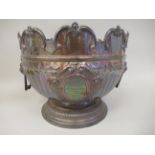 A late Victorian silver Monteith with embossed and chased, demi-fluted, scrolled ornament and