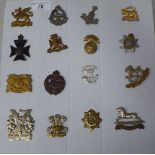 Sixteen military cap badges, some copies: to include East Lancashire, The Buffs and Tyneside