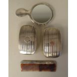 A silver backed Christening set  comprising a pair of hair brushes, a comb and a small hand