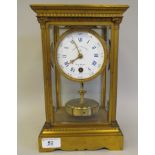 An early 20thC French gilt metal cased, four glass torsion timepiece, on a bracket plinth; the