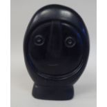 J Leon - a carved black handstone abstract bust  bears a National Gallery of Zimbabwe label  9.5"h