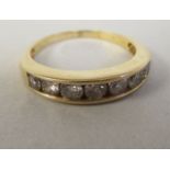 An 18ct gold diamond set half eternity ring