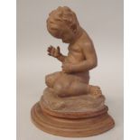 C M Amzalone - a moulded terracotta figure, a boy child, on a semi-circular plinth  bears an incised