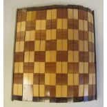 A Great War period traveller's rolled chessboard, finished in a variety of coloured veneers, mounted