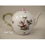 A Herend ivory glazed porcelain bullet shape teapot, having a naturalistically moulded handle and