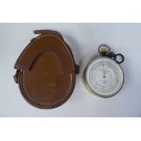 An early 20thC E R Watts & Son, London brass cased surveying aneroid compensated barometer with a