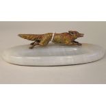 An early 20thC grey alabaster oval pen tray, surmounted by a painted cold cast bronze model, a