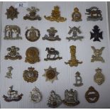 Twenty-five military cap badges, some copies: to include Lowland Regt, Royal Lancashire and 19thC