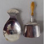 Two Georgian silver caddy spoons, one of shovel design with an elliptically turned ivory handle; the