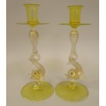 A pair of 1920s Murano tinted and speckled gilt glass candlesticks, on scrolled dolphin's head stems