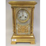 An early 20thC Continental neo-classical gilt metal and marble cased mantle clock with a platform