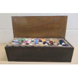 An improvised needlework box (originally a music box), containing cotton reels, tapes and all manner