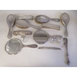 Silver backed dressing table items: to include hair brushes and a hand mirror  mixed marks