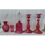 Victorian Cranberry glass collectables: to include a pair of candlesticks with castellated