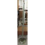 A mid 20thC standard lamp, the tubular glass rod column, on a plinth  63"h