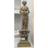 A 20thC cast brass door porter, fashioned as a robed Roman woman, on a plinth  18"h