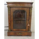 A late 19thC Continental gilt metal mounted walnut and floral marquetry pier cabinet, enclosed by