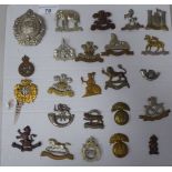 Twenty-four military cap badges, some copies: to include 3rd Dragoon Guards, 3rd King's Own