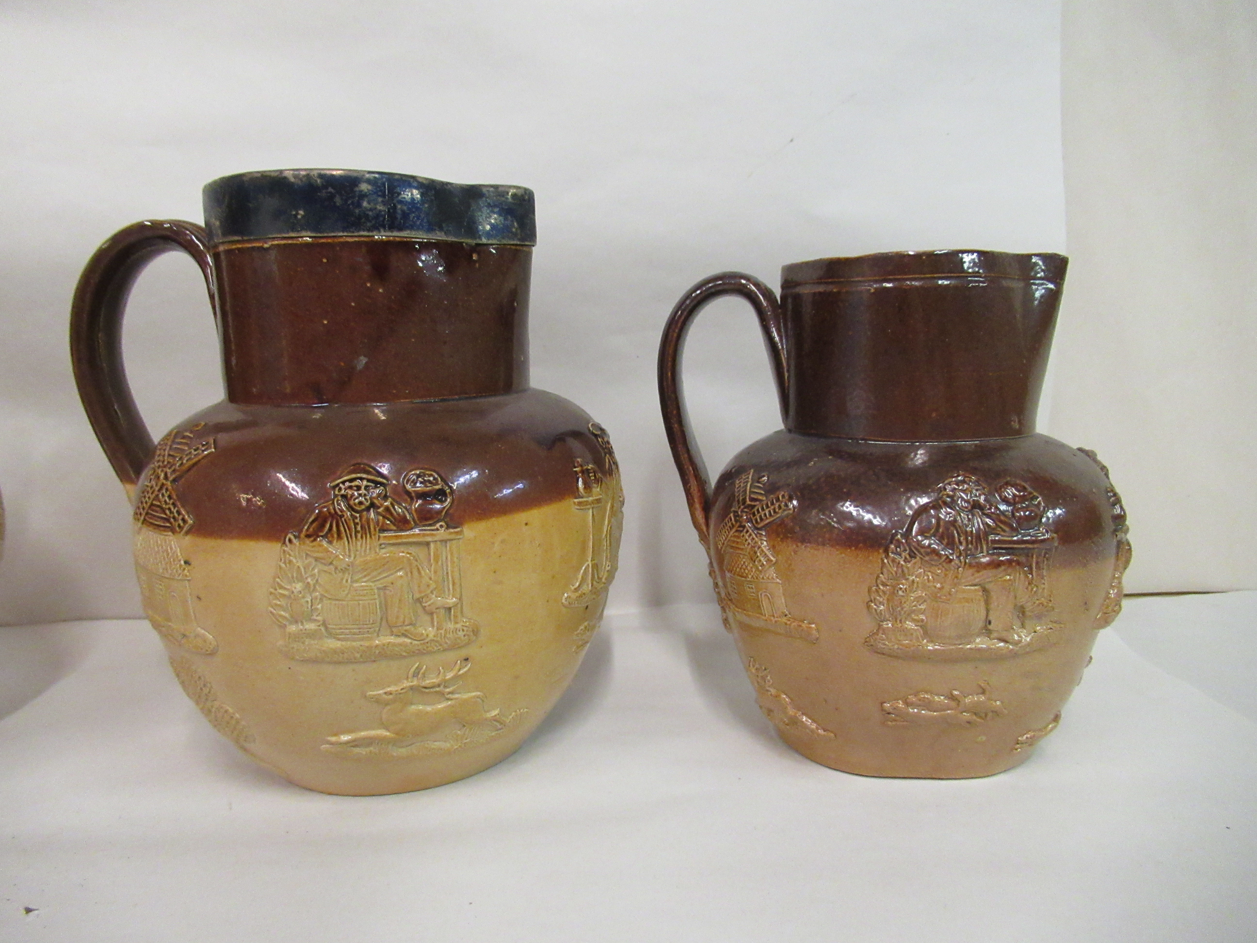 Four two tone stoneware Harvest jugs, one with a silver collar  London 1920  largest 7"h - Image 3 of 6