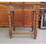 A 19thC rustically constructed washed oak side table with an overhanging top and frieze drawer,