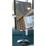 A 20thC freestanding dressing table mirror, on a chromium plated support and circular plinth  26"h