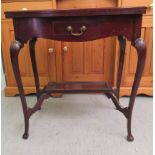 An early 20thC mahogany card table with a rotating baize lined, foldover top and frieze drawer,