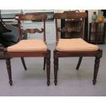 A pair of Regency mahogany and brass inlaid dining chairs with curved bar and carved splat backs,