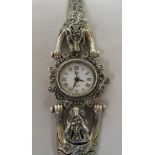 A ladies silver bracelet watch, fashioned as two opposing tigers, set with marcasite, faced by a