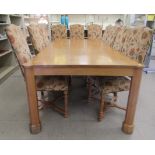 A Stuart Linford Cotswold waxed burr/oak dining table, the top with outset, turreted corners, raised