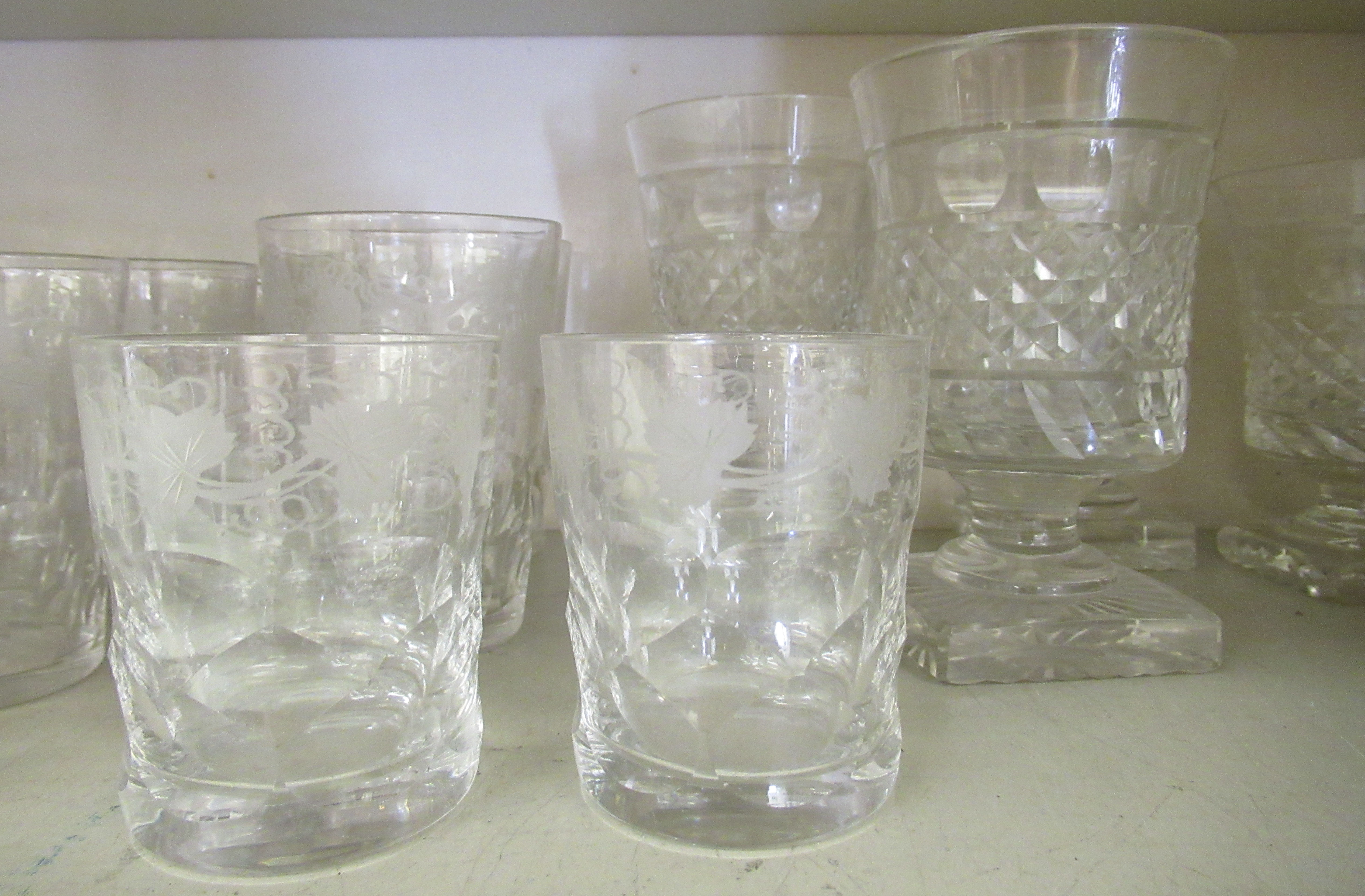 Glassware: to include a set of five early 20thC beakers with etched fruiting vine decoration  4"h - Image 3 of 4