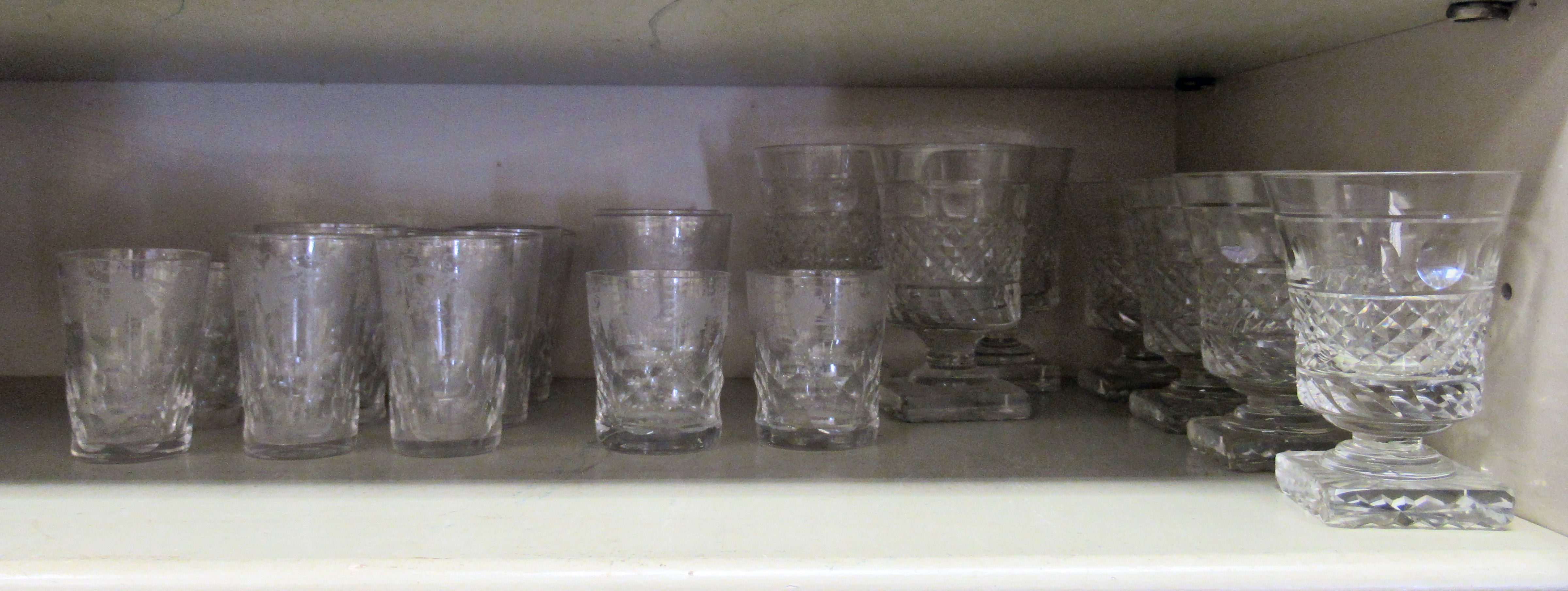 Glassware: to include a set of five early 20thC beakers with etched fruiting vine decoration  4"h