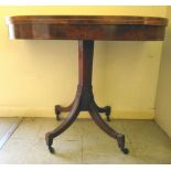A Regency satinwood and rosewood inlaid mahogany card table with a foldover top, enclosing a baize