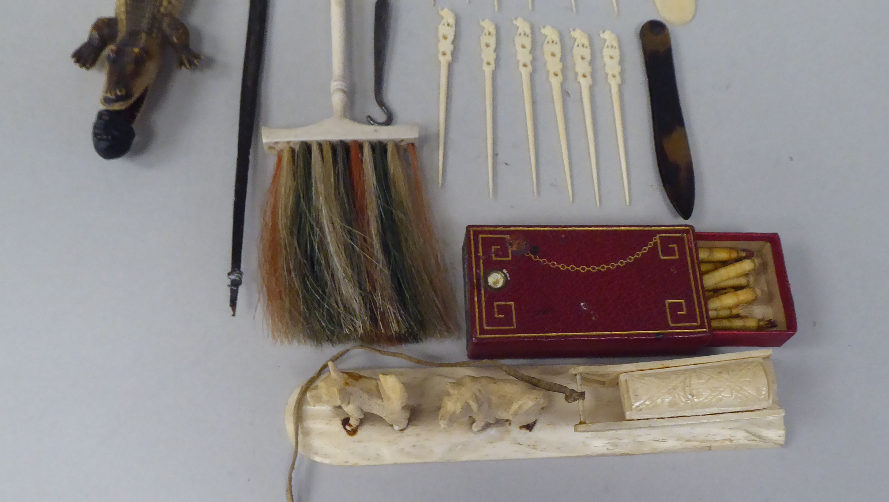 Late 19thC ivory/bone and other trinkets: to include a letter opener; a pair of huskie dogs with a - Image 6 of 9