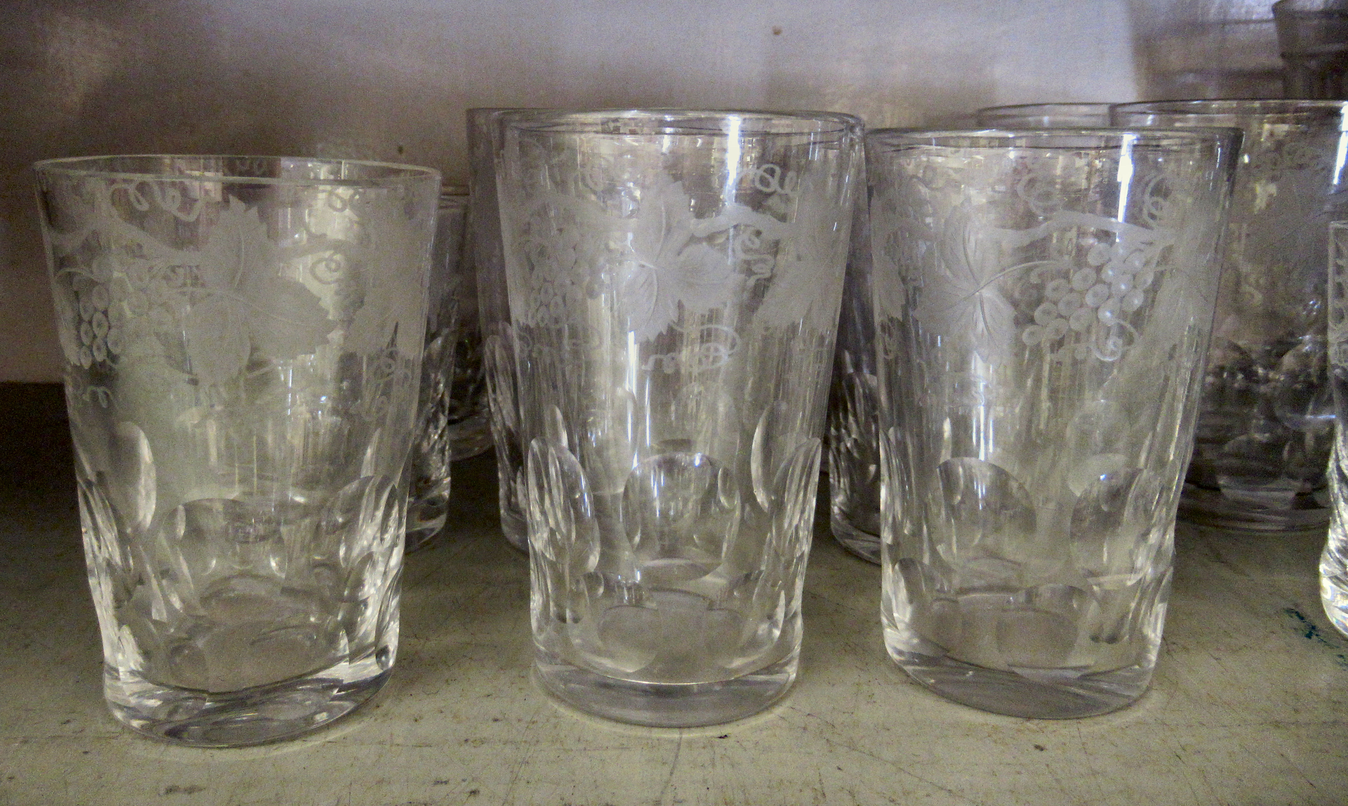 Glassware: to include a set of five early 20thC beakers with etched fruiting vine decoration  4"h - Image 2 of 4