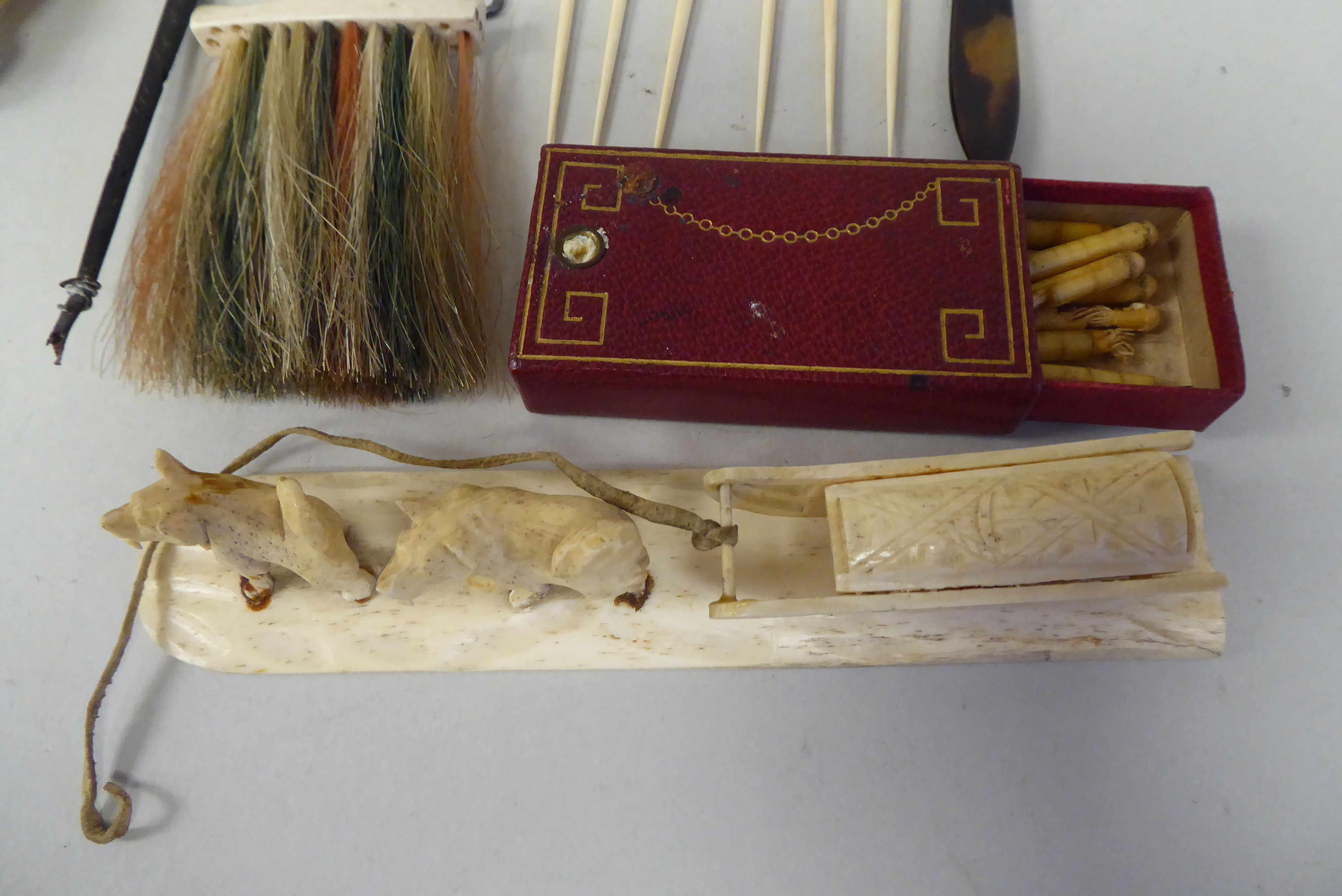 Late 19thC ivory/bone and other trinkets: to include a letter opener; a pair of huskie dogs with a - Image 2 of 9